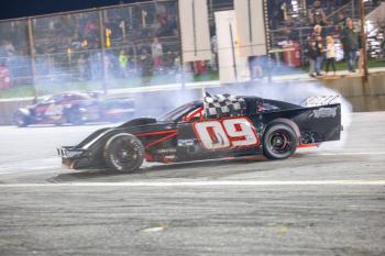 Sylas Ripley does a burnout on the front stretch after scoring his first career Modified win at Wiscasset Speedway. Jasen Dickey Photography