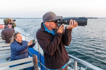 Taking photos on the Sept. 14 Sunrise Lighthouse Photography cruise. Mike Leonard photo