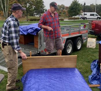 Volunteer Chris Goodwin dickers with a customer Oct. 5 during the American Legion yard sale. BILL PEARSON/Boothbay Register Chris salesman