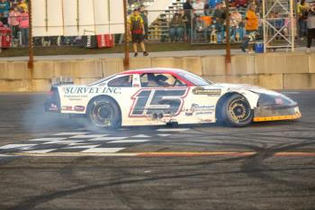 Frank Moulton does a celebratory burnout after being crowned the 2024 Late Model champion at Wiscasset Speedway. Jasen Dickey Photography White race car
