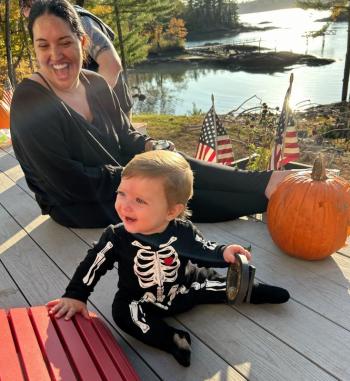 A child, a woman and a pumpkin