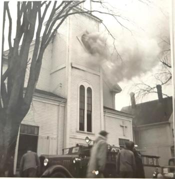 Passersby take in the scene of the Jan. 26, 1951 fire. Courtesy of First United Methodist Church Two passersby take in the scene. Courtesy of the First United Methodist Church