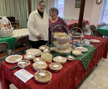 Carol Colby, left, and Gail Boudin display a bevy of delicious offerings Nov. 26 at Edgecomb Community Church's Annual Pie Sale. BILL PEARSON/Boothbay Register Boudin Colby