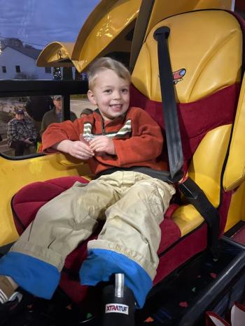 A child in the Wienermobile 