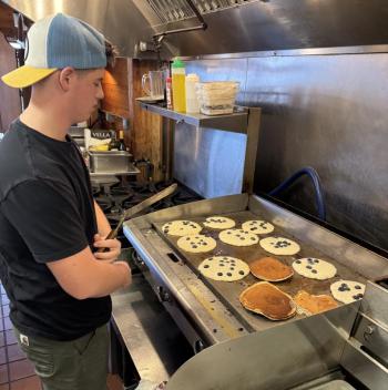Griffin Yereance waits for some pancakes to cook. Jen Mitchell photo Griffin Yereance