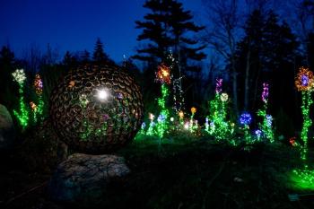 A JBONE sphere in one of the Gardens Aglow scenes at Coastal Maine Botanical Gardens 2024. Courtesy photo A JBONE sphere in one of the Gardens Aglow scenes at Coastal Maine Botanical Gardens 2024. Courtesy of ??