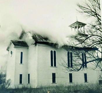 Smoke billows from the original church on Jan. 26, 1951. Courtesy of First United Methodist Church Smoke billows from within. Courtesy of the First United Methodist Church