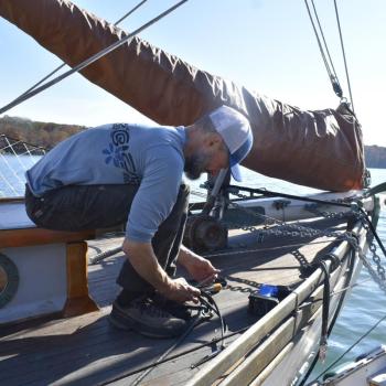 A man works on a boat