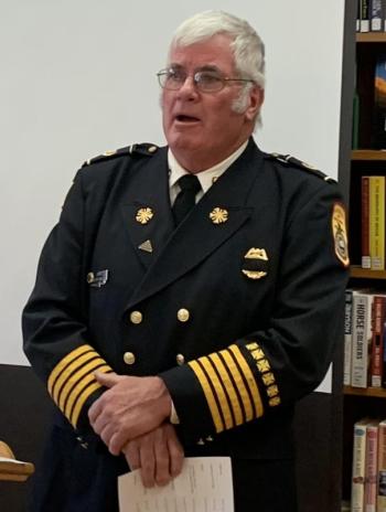 Fire Chief Gerry Gamage led the audience in singing "God Bless America" and "You're A Grand Old Flag” during the Veterans Day ceremony. BILL PEARSON/Boothbay Register Fire chief