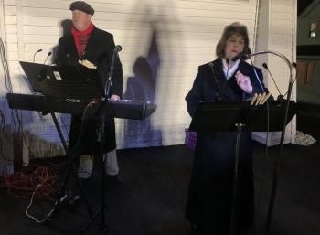 Christine Splaine reads a Biblical passage Dec. 7 during Our Lady Queen of Peace's live nativity scene. BILL PEARSON/Boothbay Register Reader