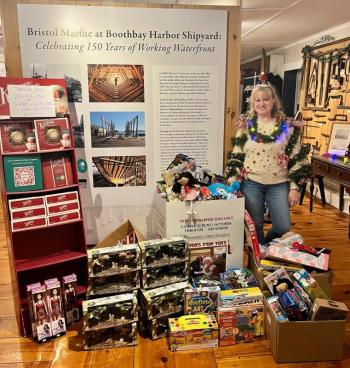 Jen Field celebrating the success of the final night of donations at Bristol Marine's toy drive. Courtesy Dennis Gunderson