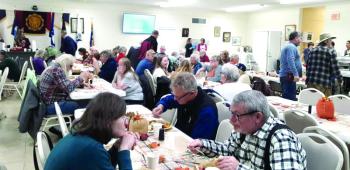 Diners enjoy American Legion's free community Thanksgiving Feast. JANE CARPENTER/Boothbay Register Diners