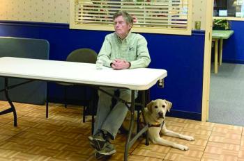 Jim Kutsch, former president of Seeing Eye Inc., and his dog, Easton, talk history of the first guide dog school in North America. ISABELLE CURTIS/Boothbay Register