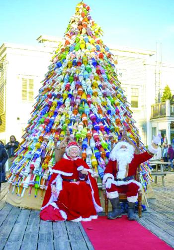 Mr. and Mrs. Claus under the pot buoy tree. FRITZ FREUDENBERGER/Boothbay Register