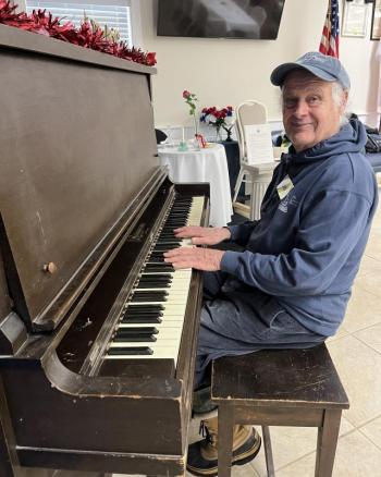 Bob Moore plays some Christmas music at the dinner. Courtesy of Barb House Christmas dinner at Legion Hall