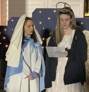 Madaline Bilodeau portrayed 'Mary' and Erin Botts played an 'angel' during Our Lady Queen of Peace's live nativity scene on Dec. 7. BILL PEARSON/Boothbay Register Mary Angel
