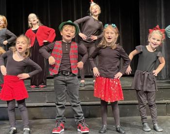 Front row: Cora Tindal, Oscar Mirabile, Josie Roy, Jackie Cronk; back row: Finley Piercy, and Kaylee Wayda perform in "We Are Santa's Elves".  