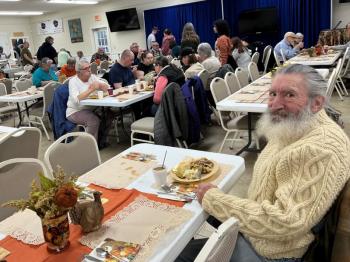 Vietnam veteran Phillip Tauber of East Boothbay enjoys Thanksgiving dinner. Courtesy of David Patch Phillip Tauber