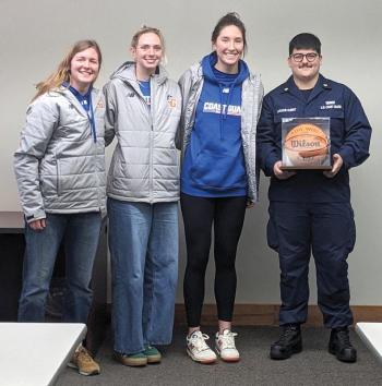 Team seniors honor Laroche-Albert with a signed basketball. CANDI JONETH/Boothbay Register Team seniors honor Laroche-Albert with a signed basketball. CANDI JONETH/Boothbay Register