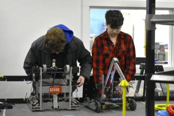 Thomas Babineau, left, and Anthony Angelico make adjustments. ISABELLE CURTIS/Boothbay Register
