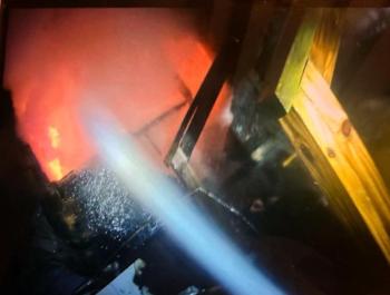 Fire attack teams spray the interior of the structure. Courtesy of Mark Sullivan Fire attack teams spraying the interior of the structure. Courtesy of Mark Sullivan