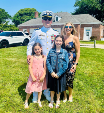 D.J. Holcomb and family during a change of command ceremony in Newport, Rhode Island. Courtesy of DJ Holcomb