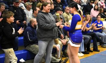 Skyla Carrier presents a carnation to her mother, Shannon Leeman, at the BRHS senior celebration Feb. 3. FRITZ FREUDENBERGER/Boothbay Register