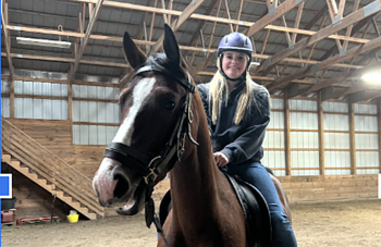 BRHS senior Harriet McKane rides atop Crash, the horse she helped break during her mentorship. Courtesy of Mary Miller