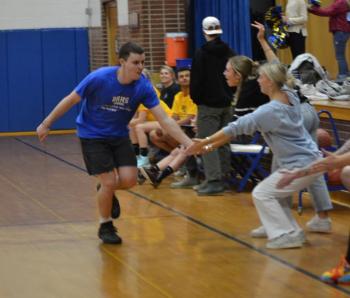 Jacob Leonard looks for some "low fives" from his coaches and teammates after nailing a 3-pointer. KEVIN BURNHAM/Boothbay Register