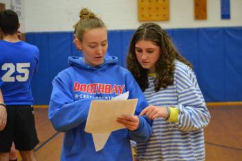 Maddie Orchard, left, and Abbie Clark figure out who won the "Huck-a-Hawk." KEVIN BURNHAM/Boothbay Register