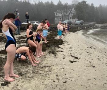 Leprechaun Leap participants line up to run into the ocean. Courtesy of Toby LeConte