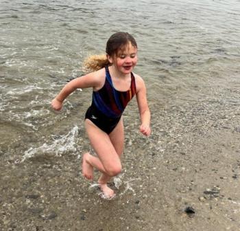 A Leprechaun Leap participant comes out of the water. Courtesy of Toby LeConte