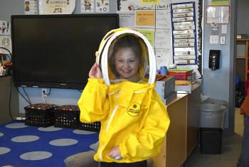  First grader Amelia Noyes shows off her bee-keeping gear, courtesy of Barter Island Bees. ISABELLE CURTIS/Boothbay Register
