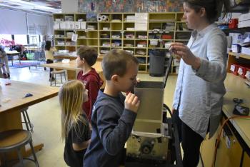 Students take a peek inside the shredder. ISABELLE CURTIS/Boothbay Register