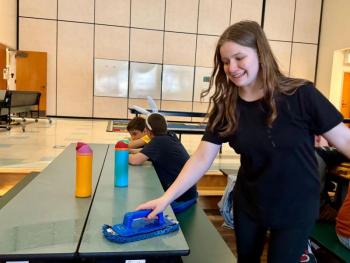 Isabel, daughter of Cashel and Brian Fanslau, makes the most of the opportunity to help clean the EES cafeteria after lunch. Courtesy photo Isabel, daughter of Cashel and Brian Fanslau, makes the most of the opportunity to help clean the EES cafeteria after lunch. Courtesy photo