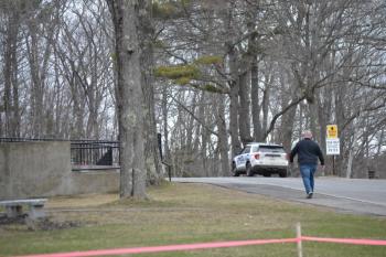 Allan Crocker walks around to the front door of the high school following the evacuation. KEVIN BURNHAM/Boothbay Register