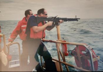 MK2 Brian Blethen in the foreground and GM2 Robert Ames in the background, re-qualifying on station weapons, on Sept. 13, 2001. Courtesy of Brian Blethen