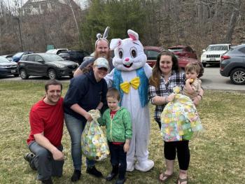 Golden Egg finders received age-appropriate Easter baskets at the April 19 EGGstravaganza. From left, Chad Murray and Caitlin Murphy with son Oliver Murray, age 5 and 51 weeks; Easter Bunny, Hannah Prest and son Hudson Martin, 17 months. LISA KRISTOFF/Boothbay Register LISA KRISTOFF/Boothbay Register