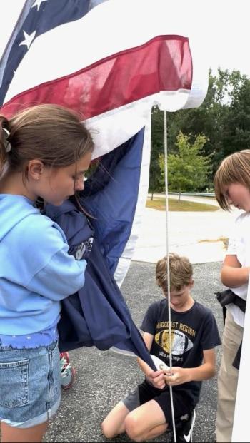 Making sure the flag is handled properly are Maxine, daughter of Pascale and Kirk Zehm; Sam, son of Daniel and Maureen Cooper; and Mason, son of Nicole McKay and Patrick Wenners. Students are residents of Alna and Edgecomb. Courtesy photo Making sure the flag is handled properly are Maxine, daughter of Pascale and Kirk Zehm; Sam, son of Daniel and Maureen Cooper; and Mason, son of Nicole McKay and Patrick Wenners. Students are residents of Alna and Edgecomb. Courtesy photo