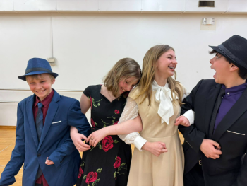 Y Arts' "Guys and Dolls Jr" cast from left: Jonathan Bernier (Nathan Detroit), Fiona Bishop (Adelaide), Jessie Ullo (Sarah Brown), & Collin Cantillo (Sky Masterson). Courtesy of Emily Mirabile
