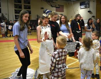 Polly Nadeau-Miller and her team interact with a young voter at BRES's 2nd annual Trashion Show. ISABELLE CURTIS/Boothbay Register