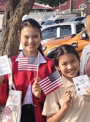 Pin and Sprite ready to fly to Maine. Courtesy of Ellen James, Friends of Thai Daughters