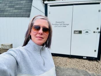 Linda Harriman, general manager of Midcoast Properties, with the storage unit the company donated to Legion Post 36. Courtesy of Linda Harriman