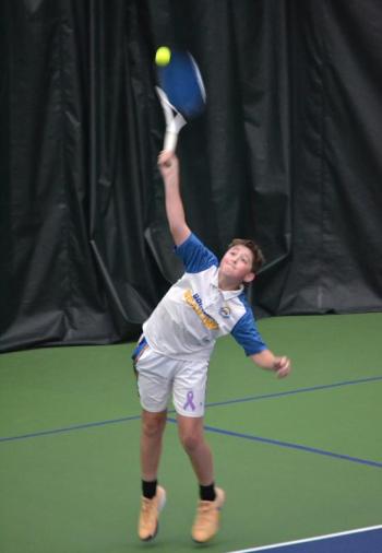 Seahawk freshman Avery Fowlie serves during his double match against Winthrop on May 7. KEVIN BURNHAM/Boothbay Register