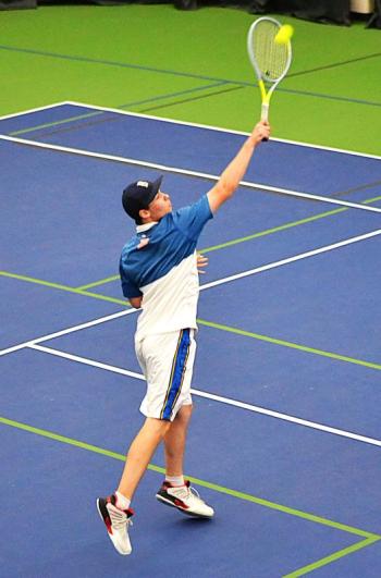 Seahawk sophomore Cole Hyson makes an over-the-head return during his doubles match against Winthrop May 7. He and partner Harry Hinckley won, 10-4. KEVIN BURNHAM/Boothbay Register