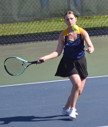 Izzy Andreasen, playing third singles, gets a good look for a return on May 14 against Spruce Mountain. KEVIN BURNHAM/Boothbay Register