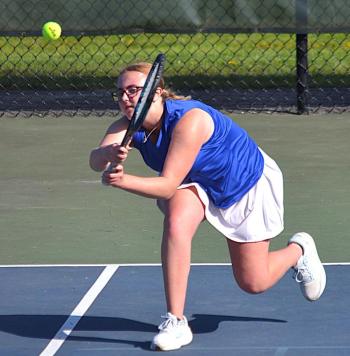 Hannah Kreft, playing second singles, makes a lunging backhand shot against Spruce Mountain May 14. KEVIN BURNHAM/Boothbay Register
