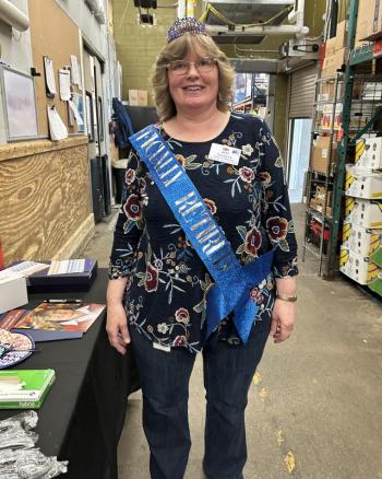 Beth Hardwick, wearing her "Officially Retired" sash and crown, during her retirement celebration in the stock room of the Boothbay Harbor Hannaford on Thursday, May 15. KEVIN BURNHAM/Boothbay Register