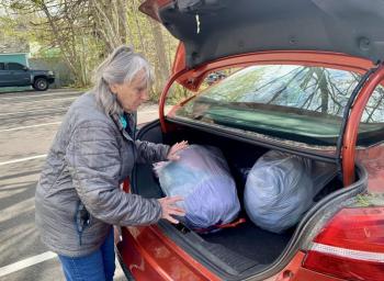 Betsy Dunton loads up her car with out-of-season clothes to donate to the Salvation Army. ISABELLE CURTIS/Boothbay Register Betsy Davis loads up her car with out-of-season clothes to donate to the Salvation Army. ISABELLE CURTIS/Boothbay Register