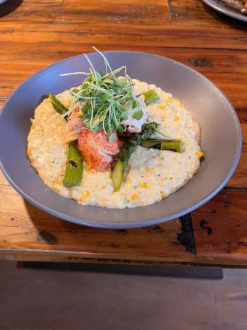 Butter poached lobster, creamy risotto, roasted corn, asparagus, Reggiano, micro arugula and Champagne vinaigrette. Courtesy of Linekin Bay Resort Seafood